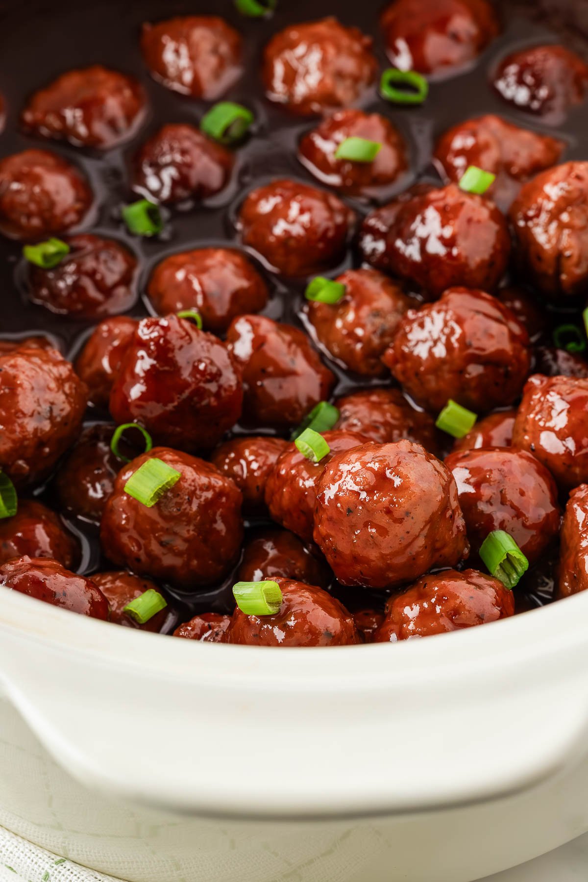 close up of meatballs in a slow cooker