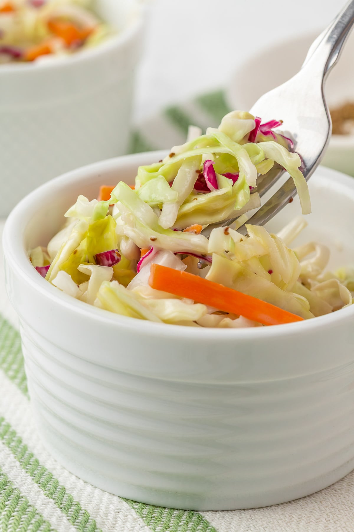 close up photo of slaw on a fork