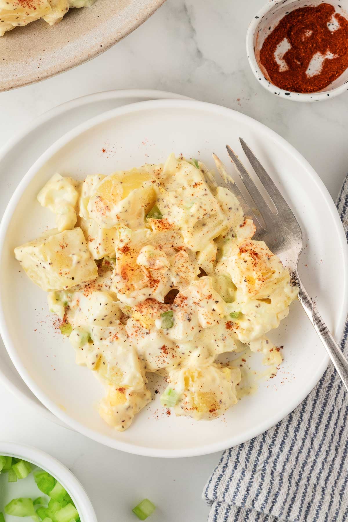 creamy side dish on a plate with a fork