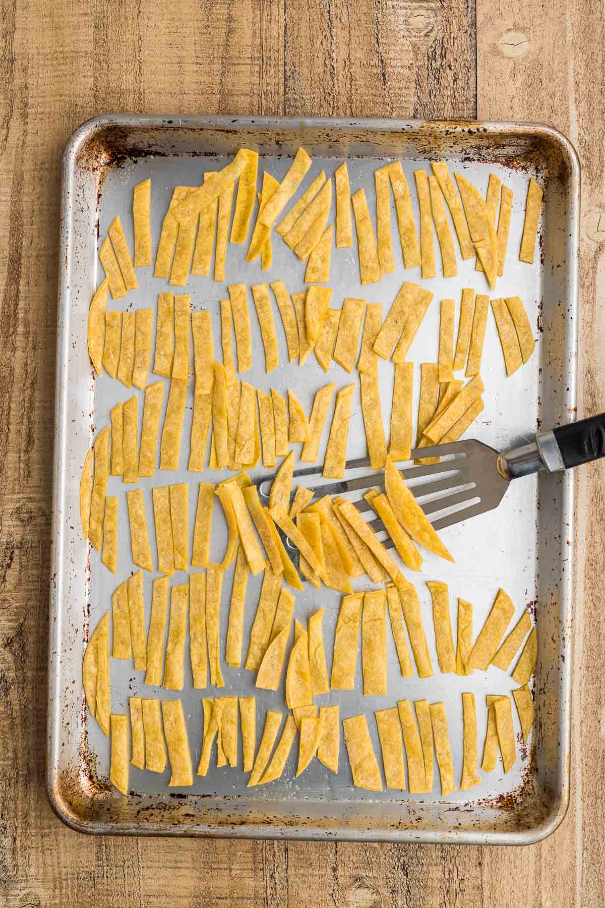 tortilla strips that have been baked on a sheet