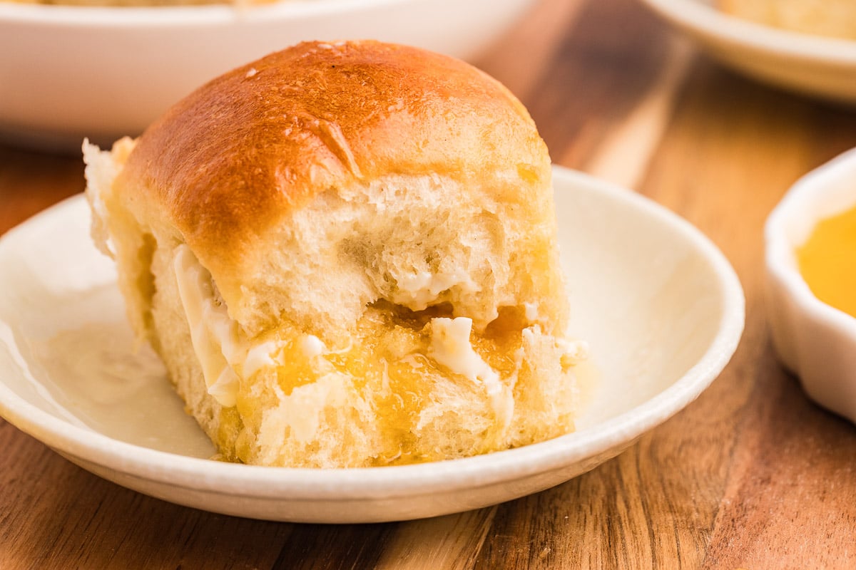 dinner roll with honey and butter