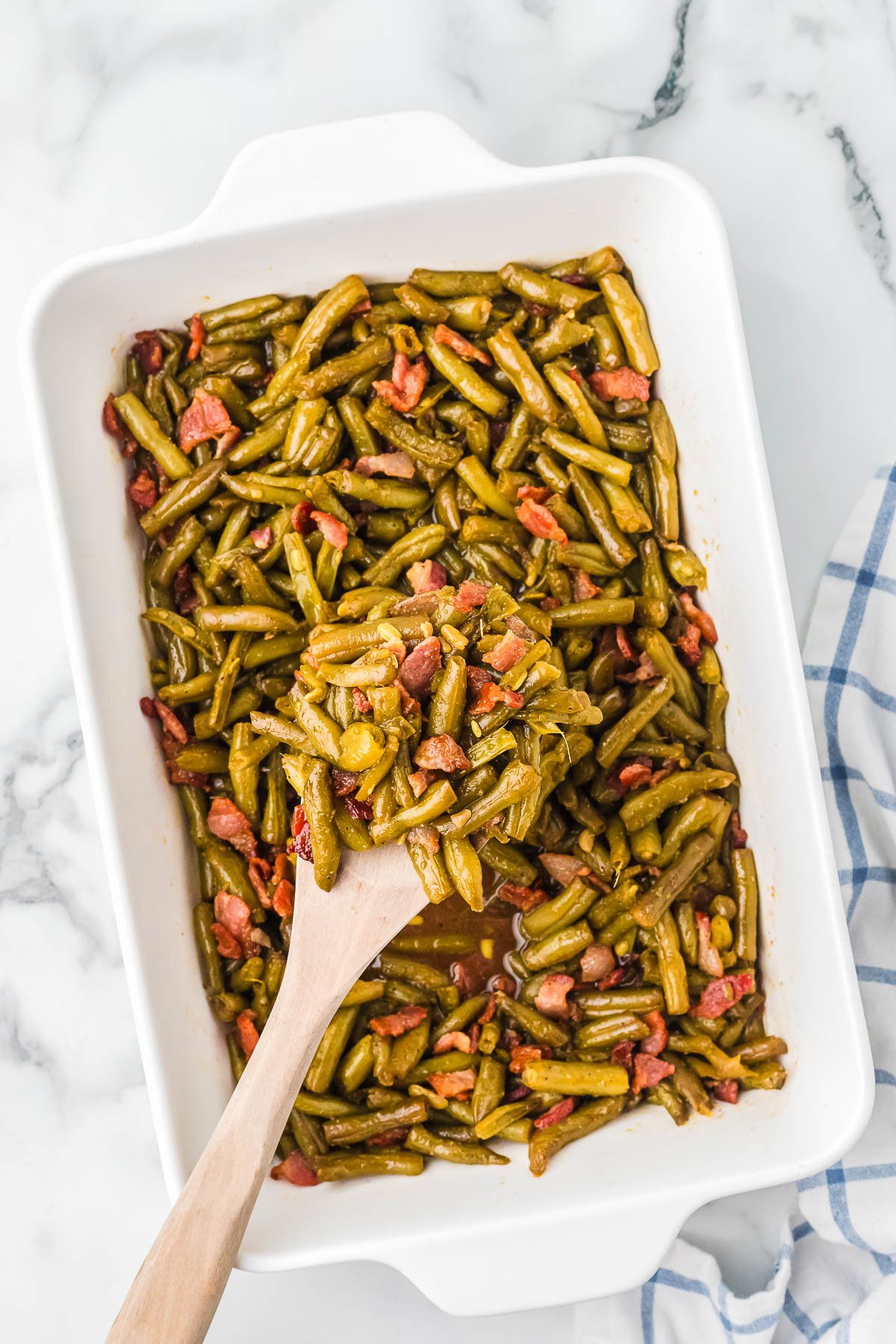 Close-up of glossy baked green beans ready to serve