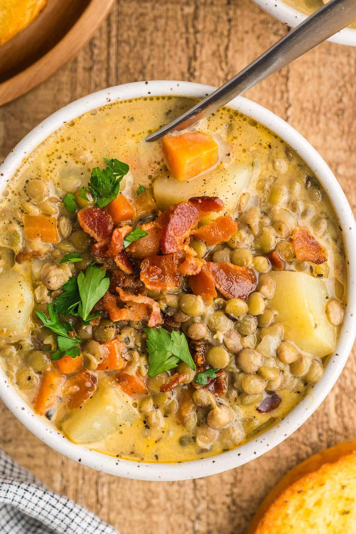 bowl of lentil soup with bacon