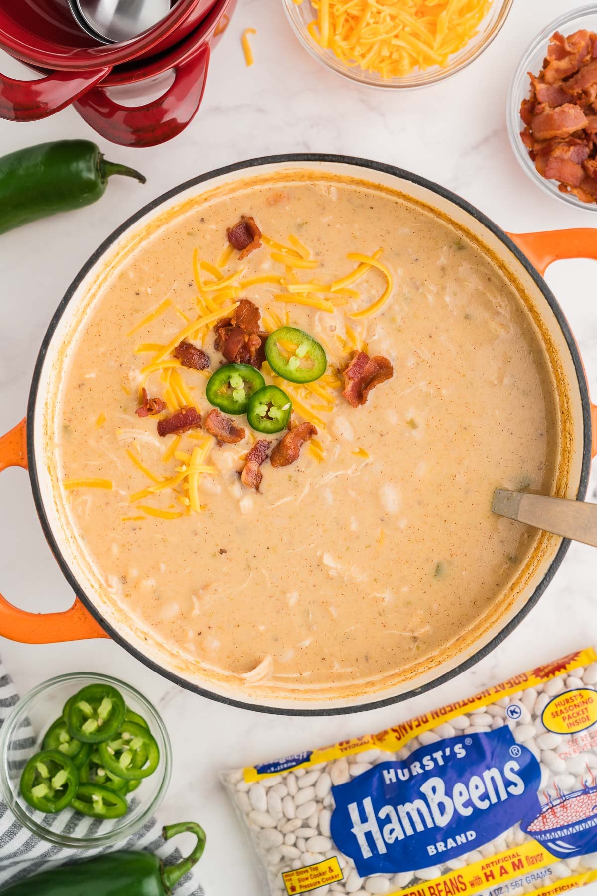 dutch oven with creamy soup and garnishes