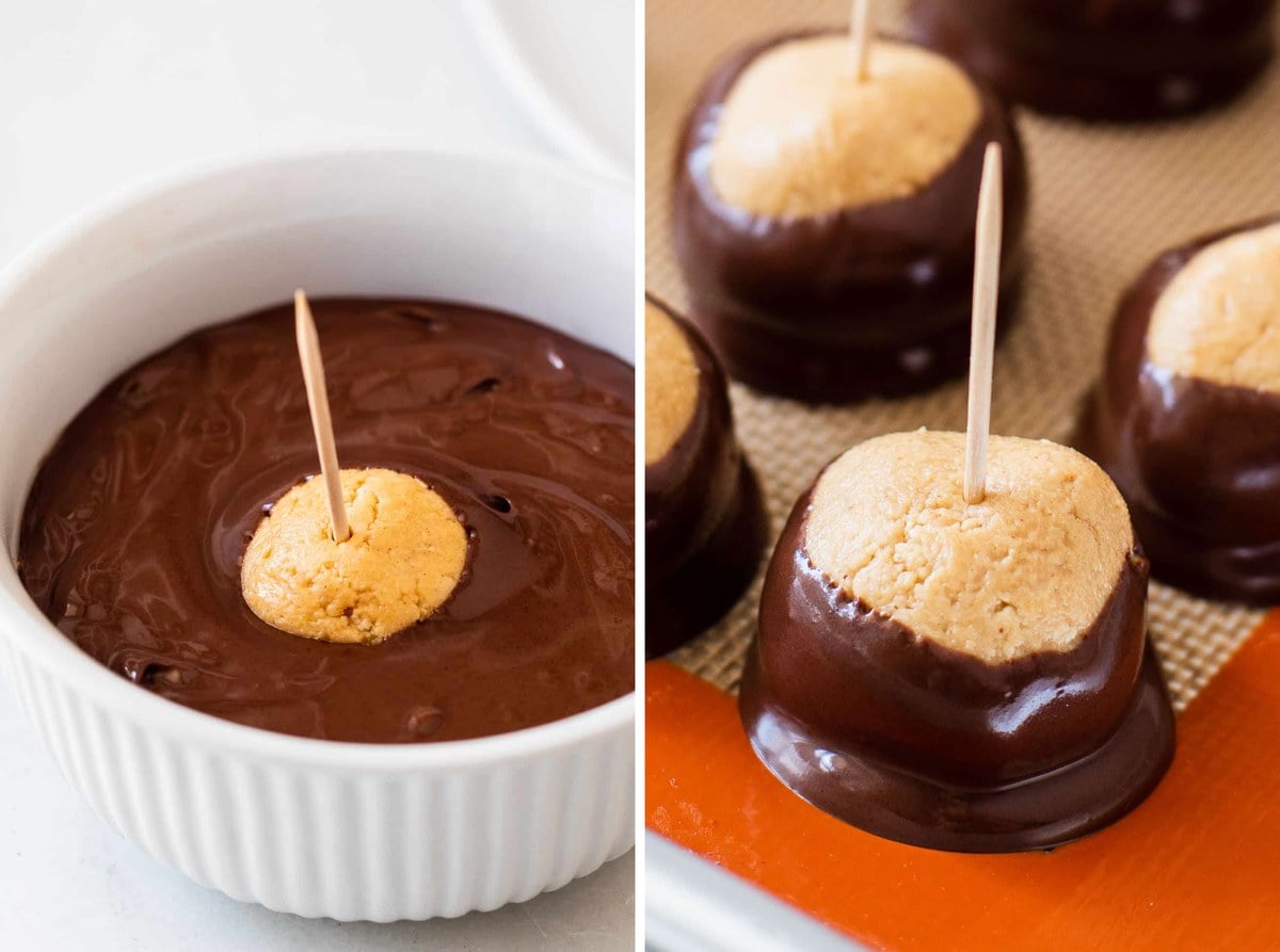 A peanut butter ball on a toothpick being dipped in melted chocolate, and dipped buckeyes on a baking sheet.