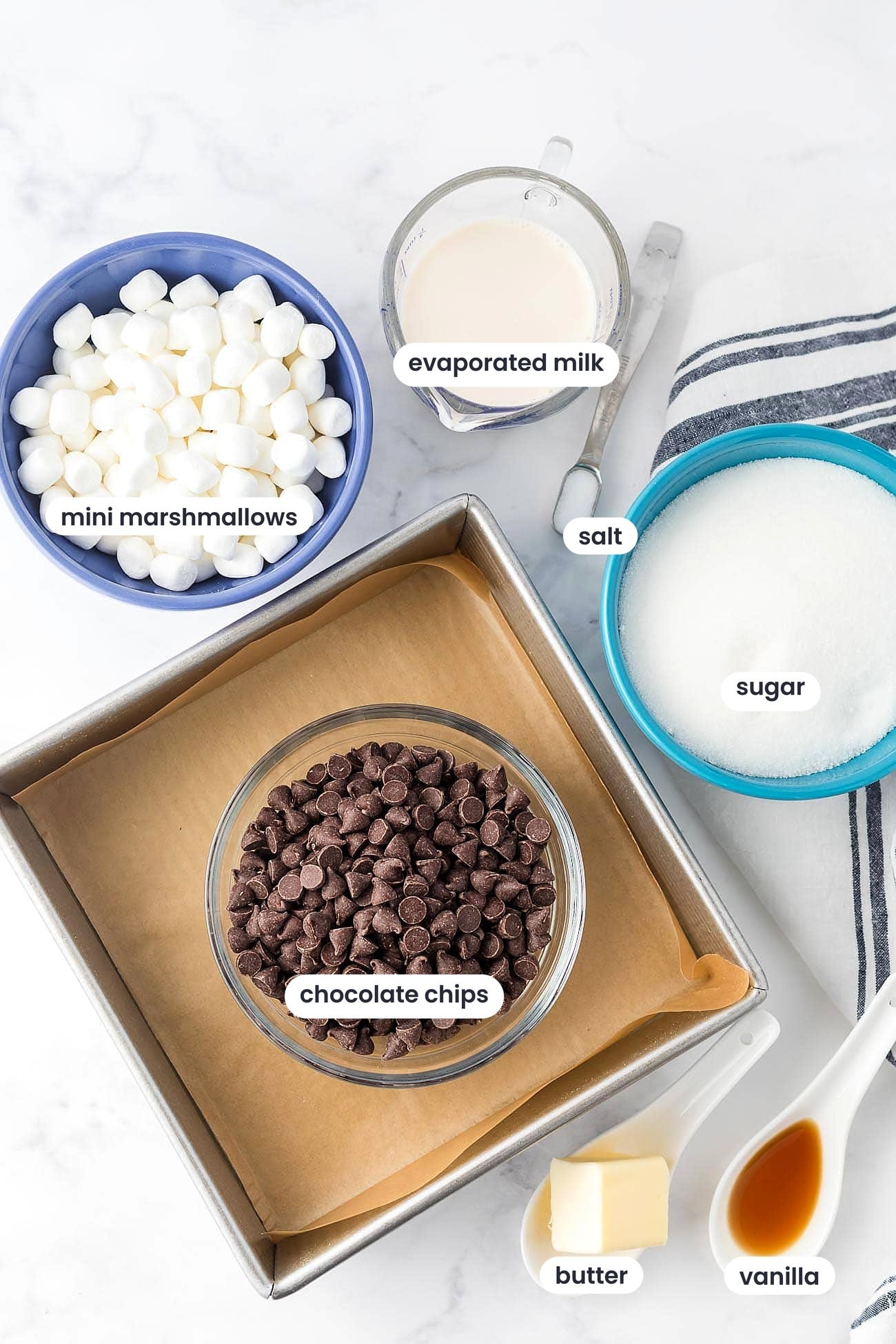 Ingredients for fudge with evaporated milk: mini marshmallows, evaporated milk, salt, sugar, chocolate chips, butter and vanilla