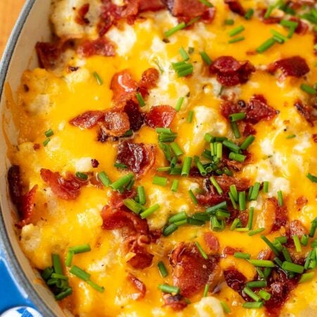Loaded cauliflower casserole with cheddar, bacon and chives.