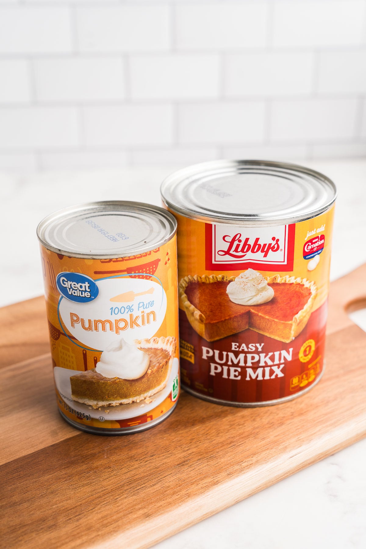 A can of pure pumpkin puree next to a can of Libby's pumpkin pie mix