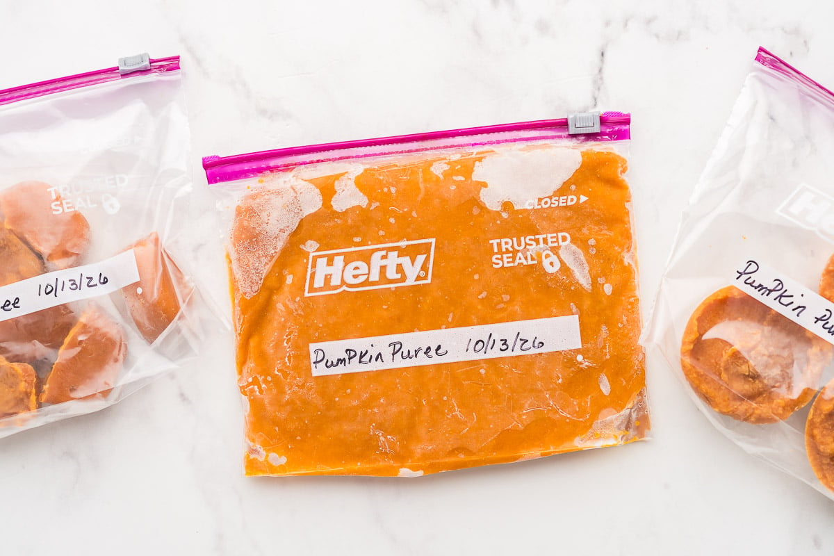 Labeled freezer bags of puree frozen flat and in small portions